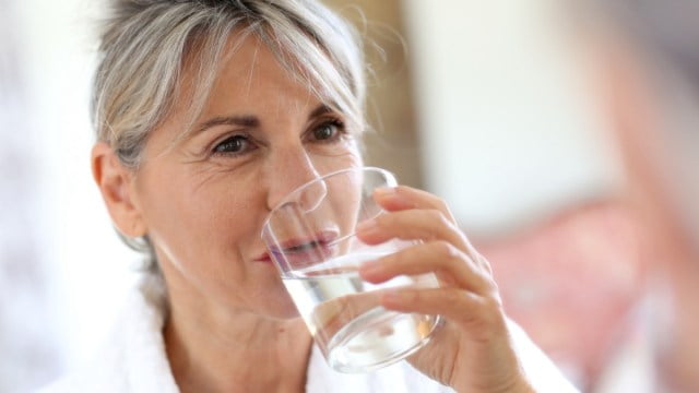 Mature Woman Drink Water Glass مجلة نقطة العلمية