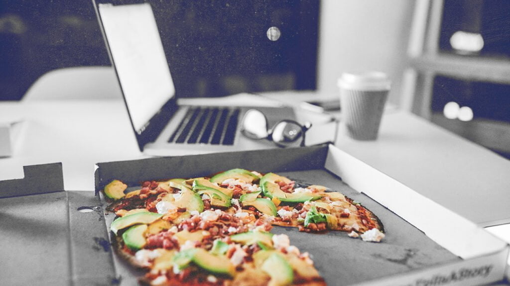 food coma pizza desk header 1024x575 1 غيبوبة الطعام: ماذا تعرف عن النعاس بعد الأكل؟ مجلة نقطة العلمية