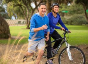 Older Couple Running Cycling مجلة نقطة العلمية