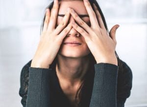 Woman Stressed Hands On Face مجلة نقطة العلمية