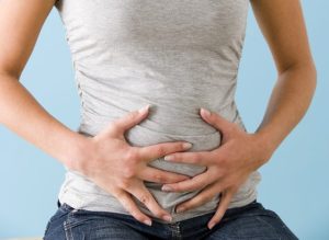 Woman Bloated Stomach مجلة نقطة العلمية