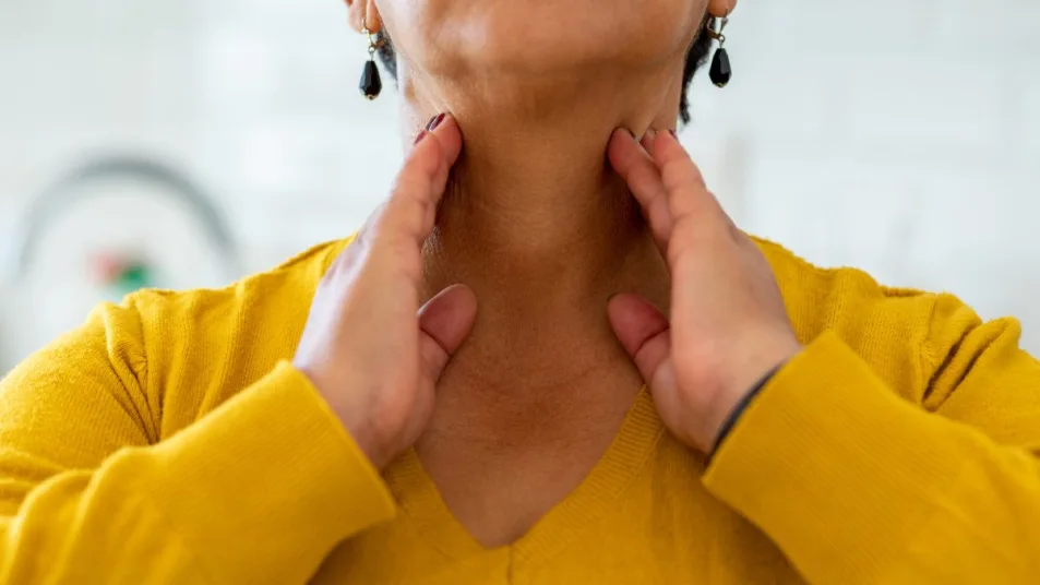 Mature Woman Touching Hands To Her Neck Checking Thyroid Health مجلة نقطة العلمية